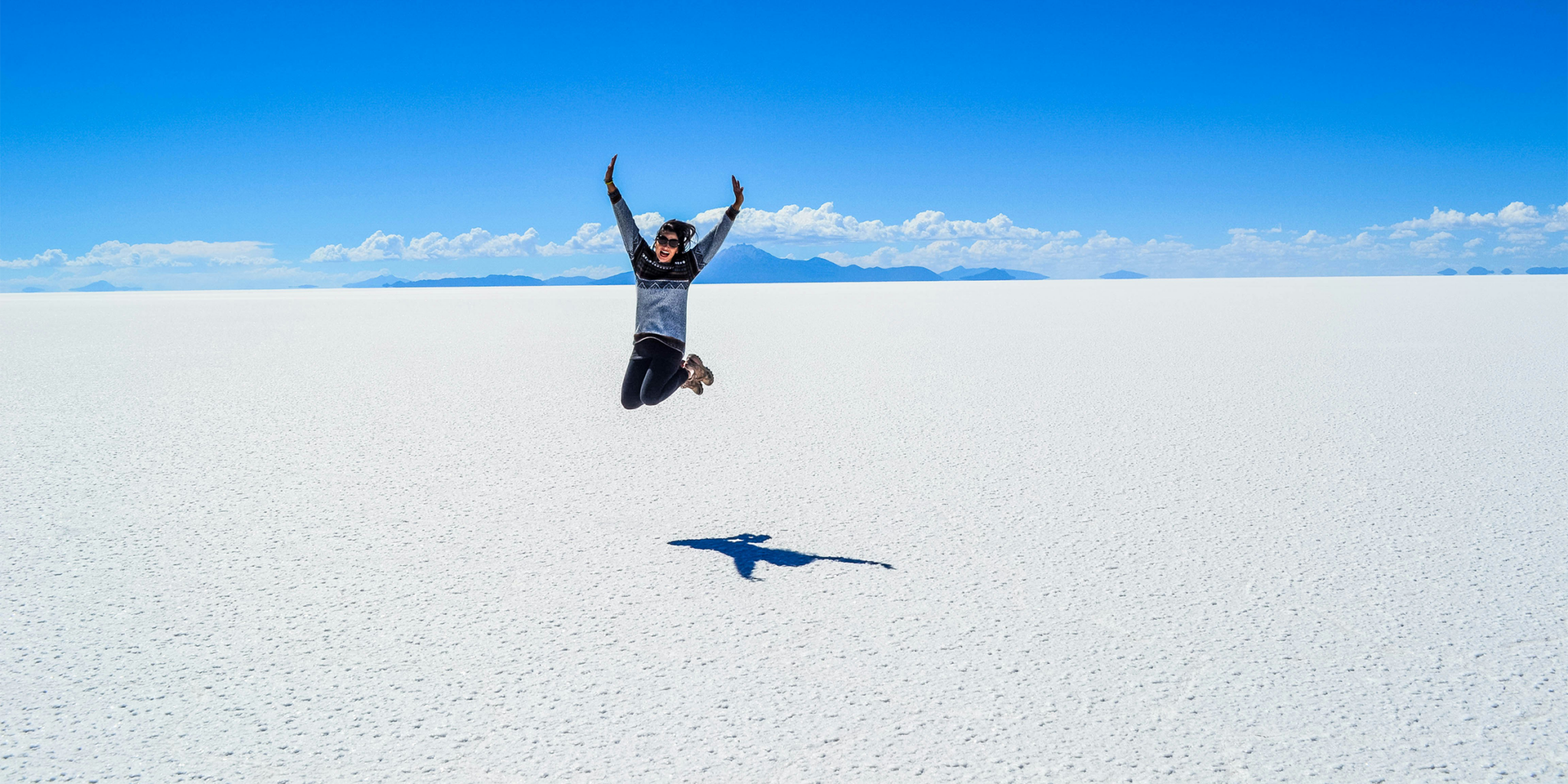 Person jumping at Salar de Uyuni